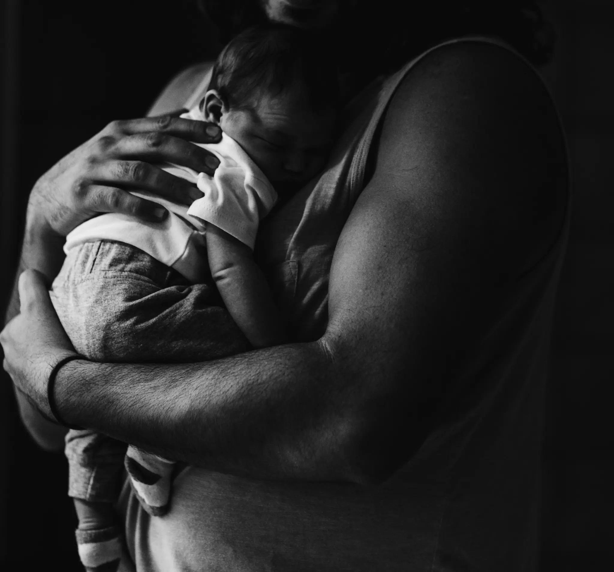 Father holding newborn baby — Melbourne doula postpartum support